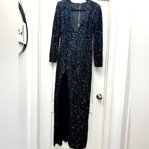 Long elegant high split sequence evening gown. Size large.